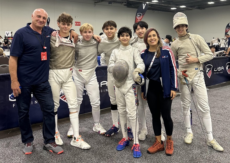 Alexander Lepeshinsky with Benjamin Gurewich and fellow young fencers at a USA Fencing event