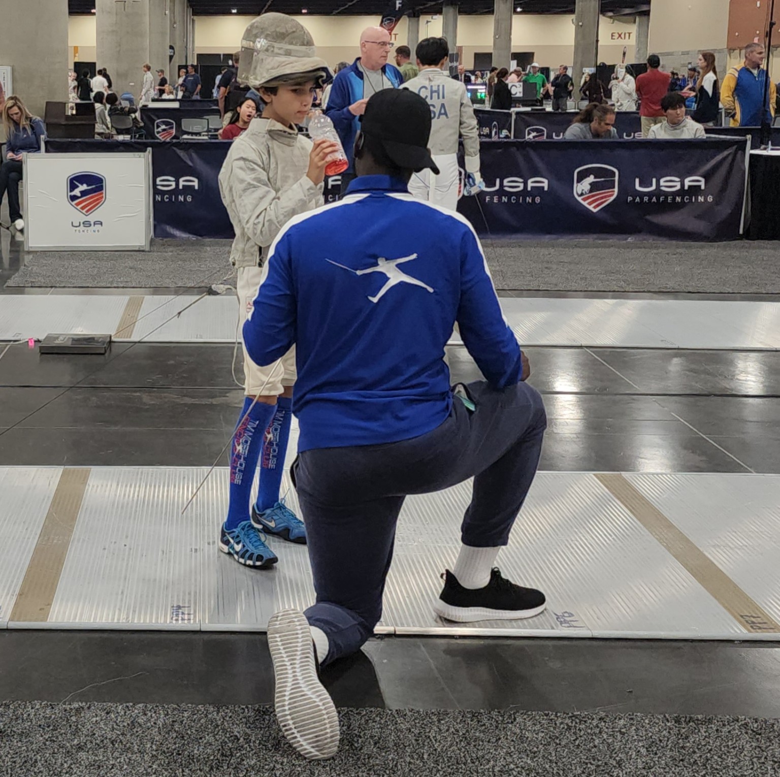 Iba Keita coaching Benjamin Gurewich beside the piste