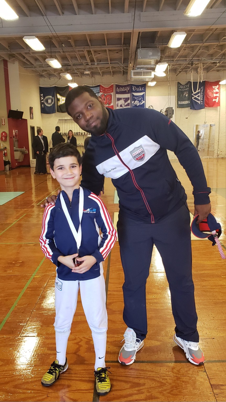 Konate Primus with a young Benjamin Gurewich after a fencing competition